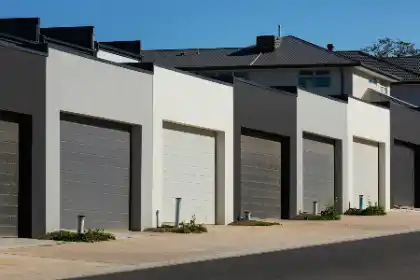 Concrete driveway in front of row of modern garages | Charleston Concrete