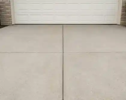 Concrete driveway in front of white building | Charleston Concrete