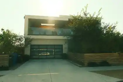 Concrete driveway outside modern house with garage and balcony | Charleston Concrete