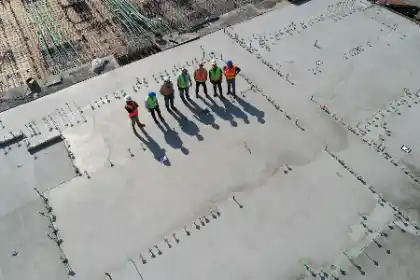 Construction team with seven workers standing | Charleston Concrete