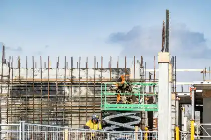 Construction workers on scissor lift | Charleston Concrete