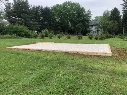 Gravel shed pad on sloping ground | Charleston Concrete