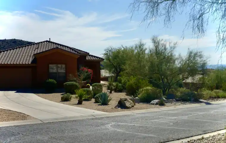 House with concrete driveway and desert landscaping | Charleston Concrete