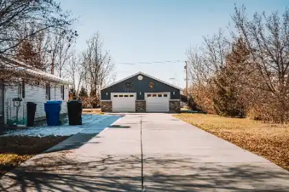 Wide suburban driveway beside residential house | Charleston Concrete