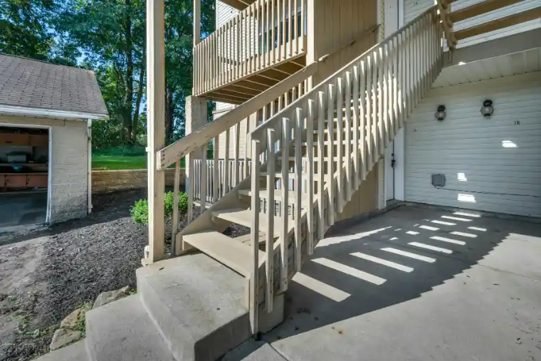 Wooden outdoor staircase providing access above ground level | Charleston Concrete
